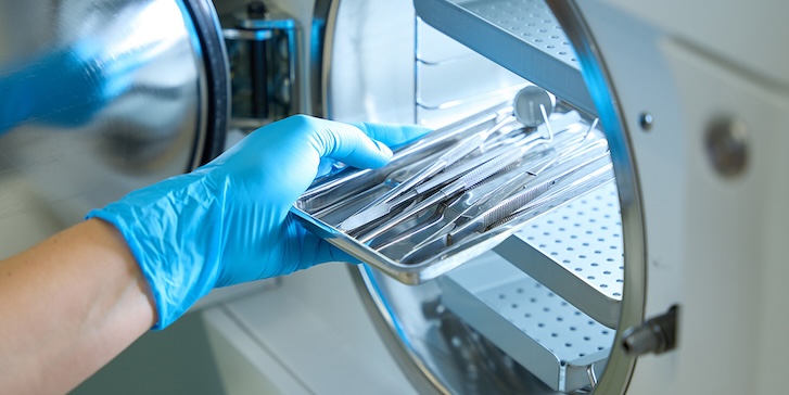 Surgical equipment being placed into a sterilizer Surgical equipment being placed into a sterilizer